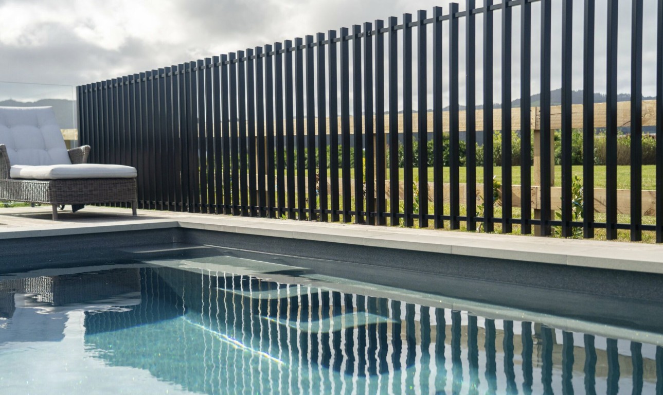 Modern aluminum pool fence with vertical slats for safety