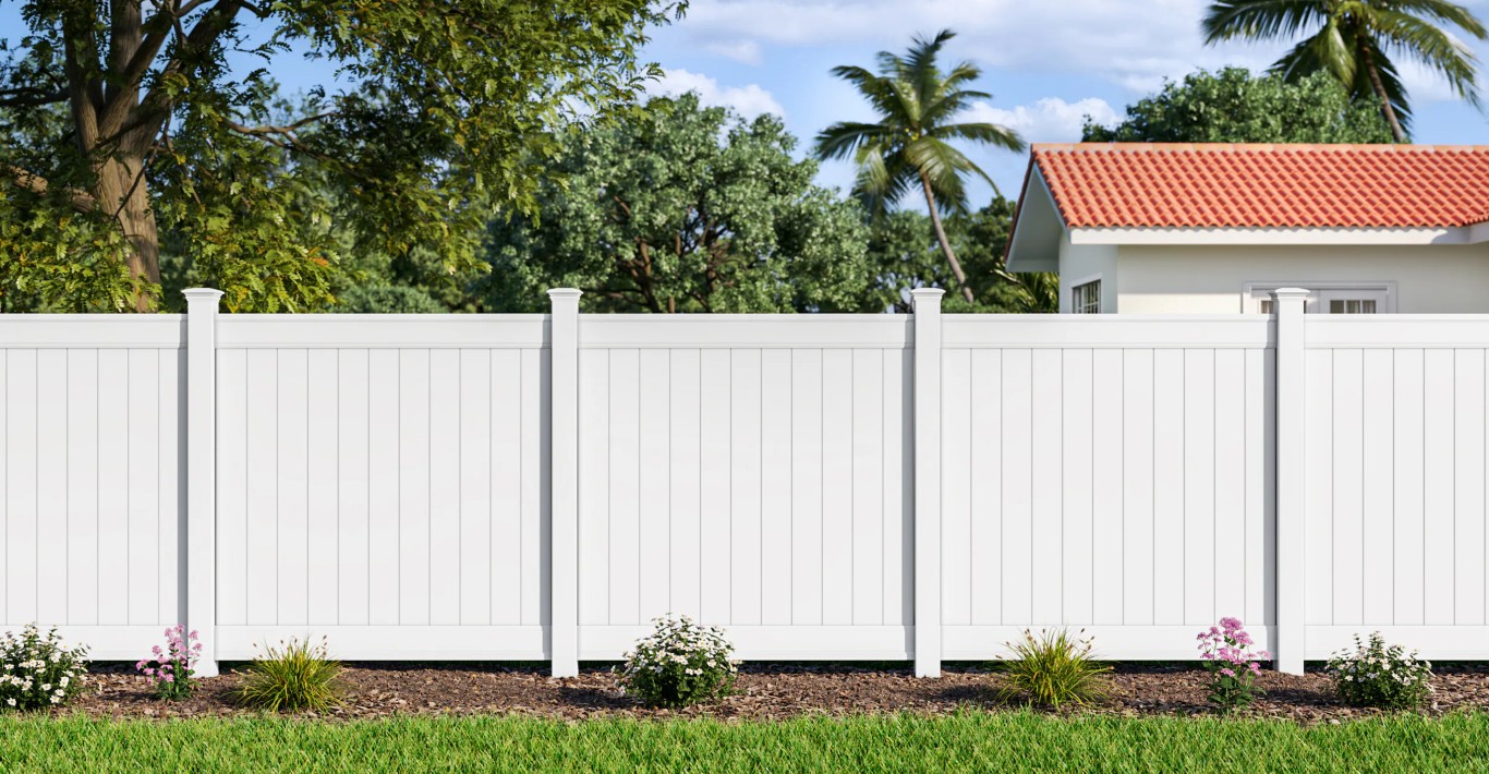 White vinyl privacy fence installation in front of home